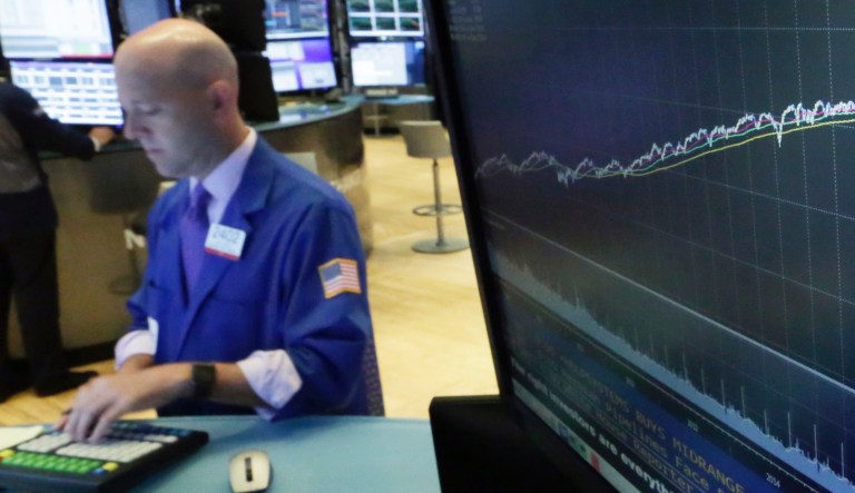 In this Aug. 22, 2018, file photo a chart on a screen on the floor of the New York Stock Exchange shows the rise of the S&P 500 index since 2009. Once derided as fads that would force investors to settle for lower returns, funds that take into account environmental, social and corporate-governance issues have held up better than traditional funds this year. It's the latest march forward for what are known as ESG funds, and the industry expects the flow of dollars to accelerate into the field.