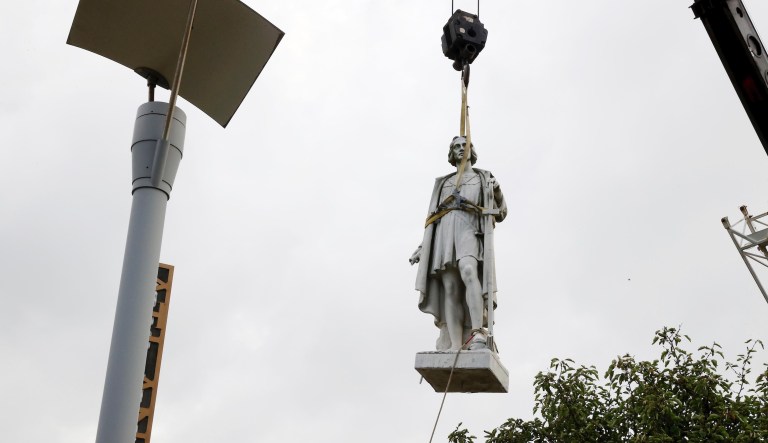 Baltimore protesters rip down Columbus statue and toss it in harbor