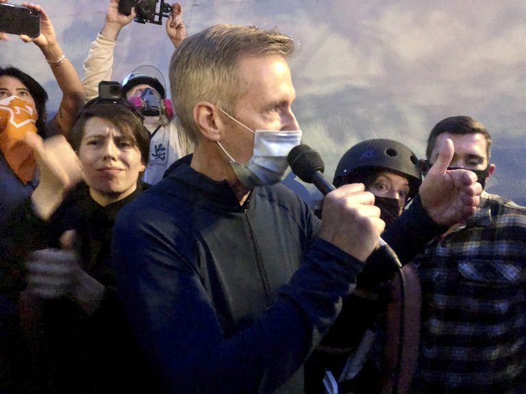 Portland police declare riot and dozens arrested on 100th straight night of protests