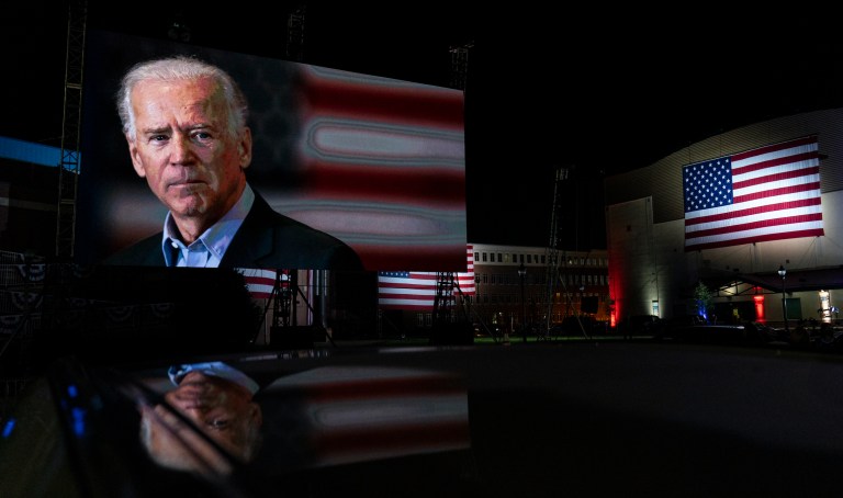 Supporters watch the program outside the venue where Democratic presidential candidate former Vice President Joe Biden is speaking, during the final day of the Democratic National Convention, Thursday, Aug. 20, 2020, at the Chase Center in Wilmington, Del.