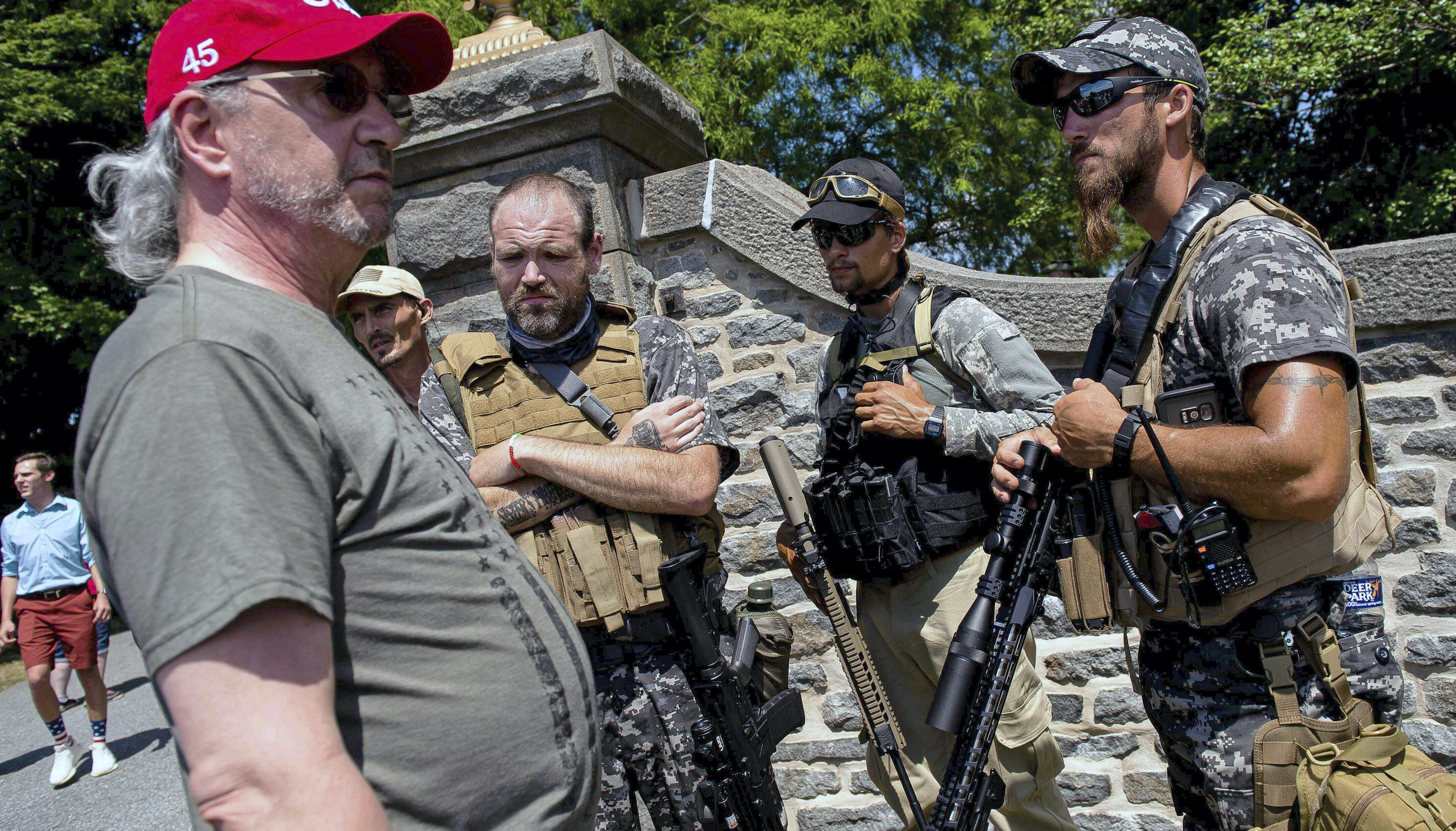 Division over armed militiamen patrolling protest-ridden cities
