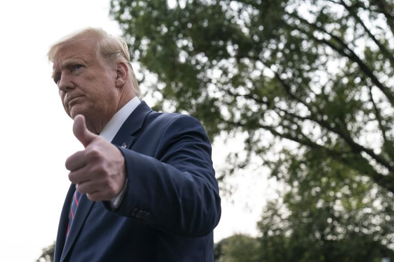 President Donald Trump gives a thumbs up after speaking with reporters as he walks to Marine One on the South Lawn of the White House Tuesday. Trump has edged Joe Biden in the latest Rasmussen Reports survey.