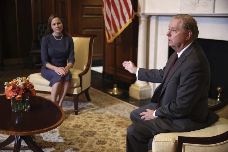 Judge Amy Coney Barrett, President Donald Trumps nominee for the U.S. Supreme Court, meets with Sen. Lindsey Graham, R-S.C., on Capitol Hill in Washington, Tuesday, Sept. 29, 2020. A new survey shows that most Americans do not want Barrett questioned about her Catholic faith.
