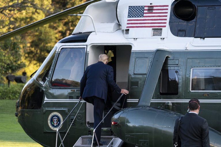 President Donald Trump boards Marine One as he leaves the White House to go to Walter Reed National Military Medical Center after he tested positive for COVID-19.