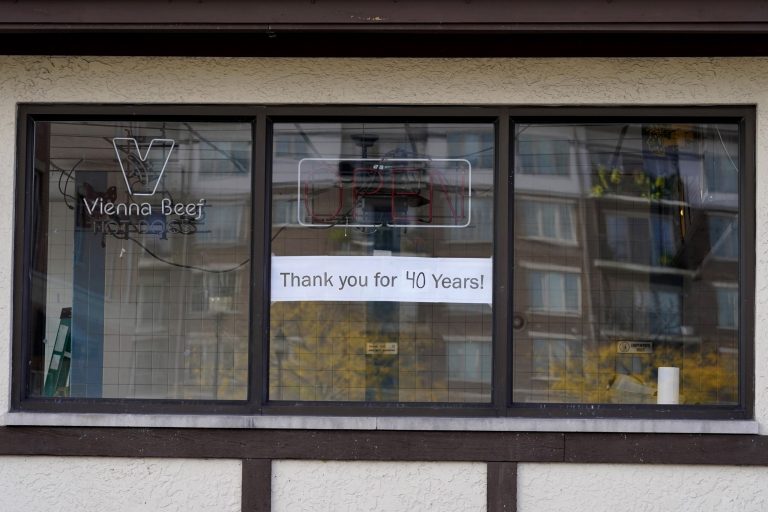 A sign is displayed at a permanently closed Submarine Express sandwich shop in Mount Prospect, Ill., Thursday, Oct. 15, 2020. Lack of aid and lawsuits are driving out many businesses.