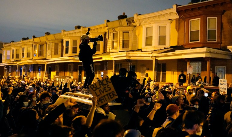 Protesters confront police during a march Tuesday Oct. 27, 2020 in Philadelphia. Hundreds of demonstrators marched in West Philadelphia over the death of Walter Wallace, a Black man who was killed by police in Philadelphia on Monday. Police shot and killed the 27-year-old on a Philadelphia street after yelling at him to drop his knife.  (AP Photo/Matt Slocum)