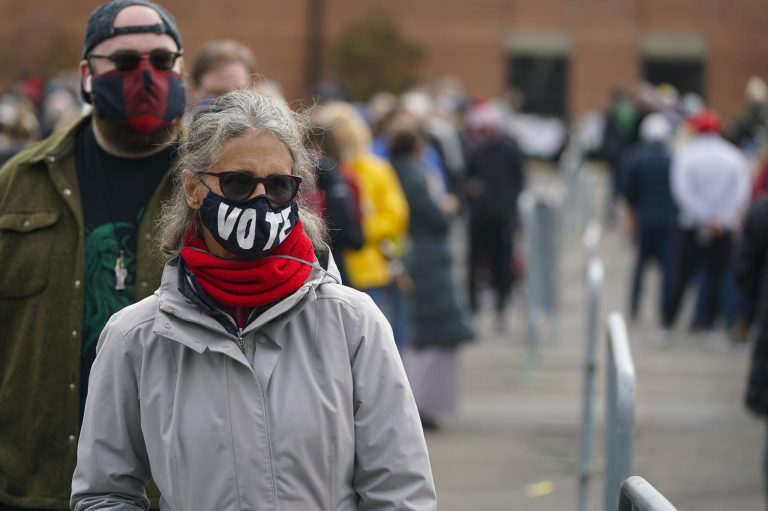 Voters wait in long lines to cast their ballots during early voting at St. Luke's United Methodist Church in Indianapolis, Wednesday, Oct. 28, 2020. NBC featured a story claiming long lines are a form of racism.