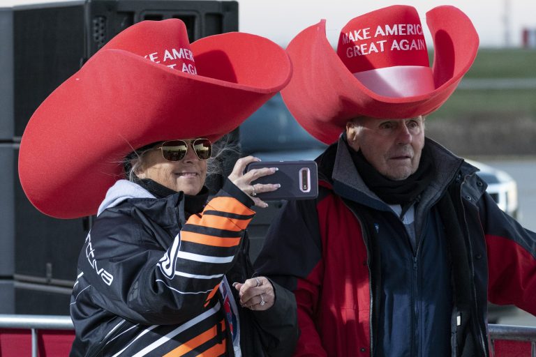 Supporters photograph President Donald Trump as he speaks at a campaign rally at Rochester International Airport, Friday, Oct. 30, 2020, in Rochester, Minn.