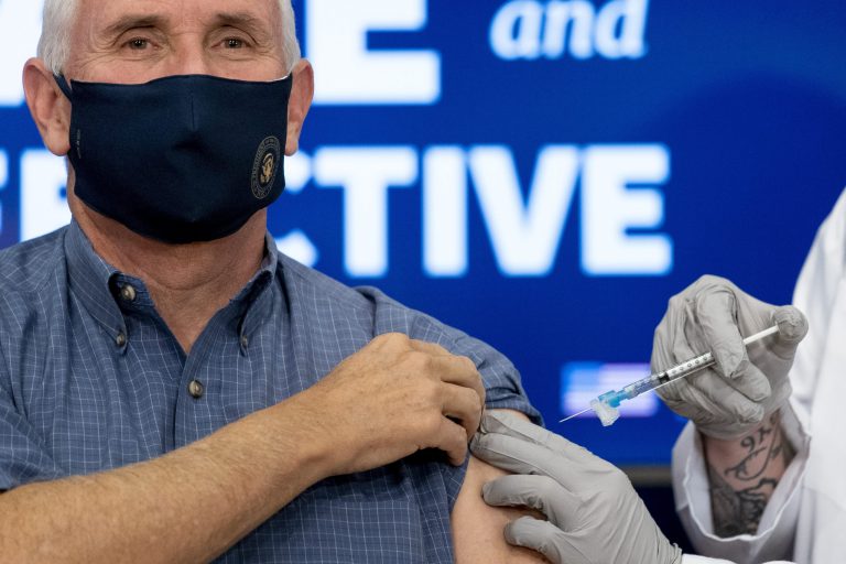 Vice President Mike Pence receives a Pfizer-BioNTech COVID-19 vaccine shot on Friday.