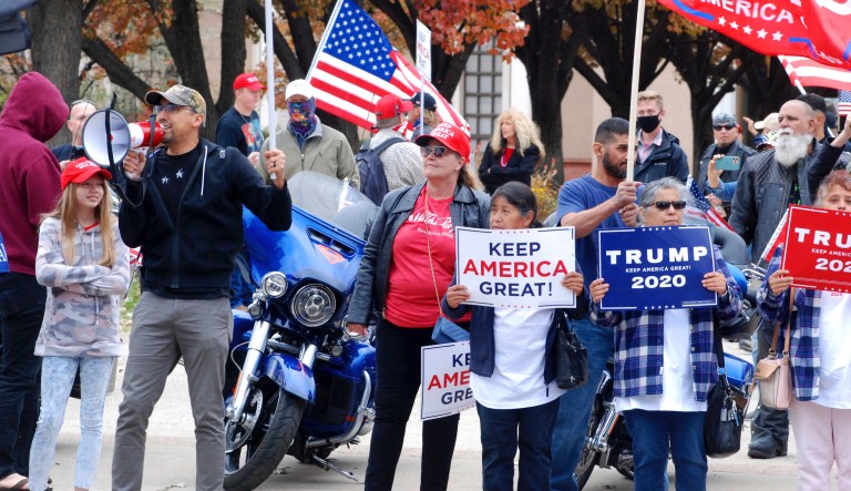 In this Nov. 7, 2020, file photo, hundreds of supporters of President Donald Trump stage a defiant rally outside the New Mexico state Capitol building in Santa Fe, N.M. Voters participated in record numbers while choosing Joe Biden by an 11% margin over Donald Trump, even as the GOP won back a congressional swing seat in southern New Mexico. Most voters opted for absentee ballots due to the pandemic, while Republicans cried foul over ballot drop boxes in lawsuits.