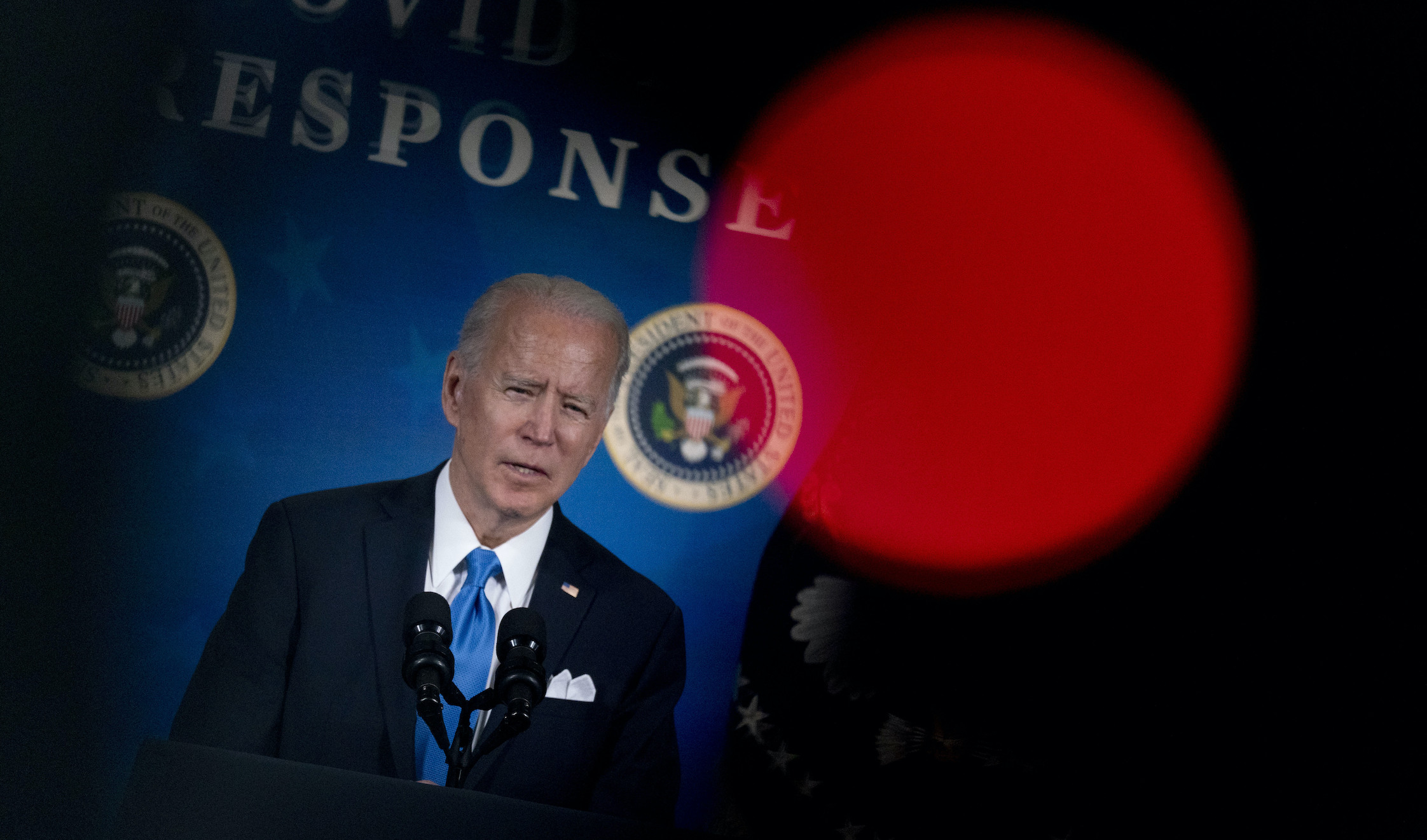 Biden takes veiled swipes at Trump during his first national address