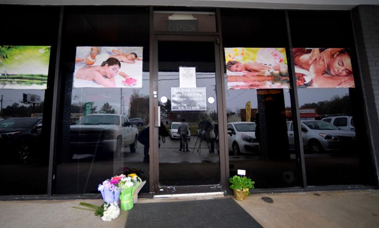 A make-shift memorial outside a business where a multiple fatal shooting occurred on Tuesday, Wednesday, March 17, 2021, in Acworth, Ga.