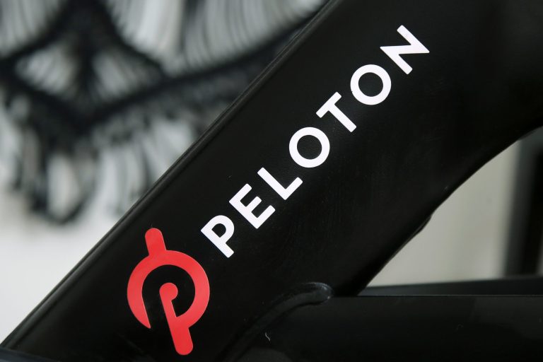 FILE - This Nov. 19, 2019 file photo shows a Peloton logo on the company's stationary bicycle in San Francisco. Peloton is recalling its treadmills after one child died and 29 other children suffered from cuts, broken bones and other injuries from being pulled under the rear of the treadmill. The U.S. Consumer Product Safety Commission said Wednesday, May 5, 2021, that Peloton received 72 reports of adults, kids, pets or other items, such as exercise balls, being pulled under the treadmill. (AP Photo/Jeff Chiu, File)