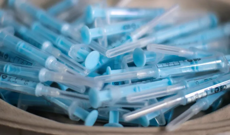 FILE - In this April 9, 2021 file photo syringes are prepared to administer the AstraZeneca vaccine against COVID-19 during a vaccination campaign at WiZink indoor arena in Madrid, Spain. =Countries in the European Union have ramped up the vaccination after sluggish start. The uptick comes as countries across Europe also grapple with a rise in infections that has pushed the EUâs overall number of confirmed cases close to 30 million.