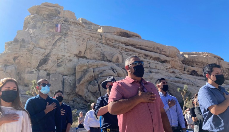 People take part in a naturalization ceremony to become U.S. citizens at a ceremony on May 4, 2021 in Joshua Tree National Park, Calif.