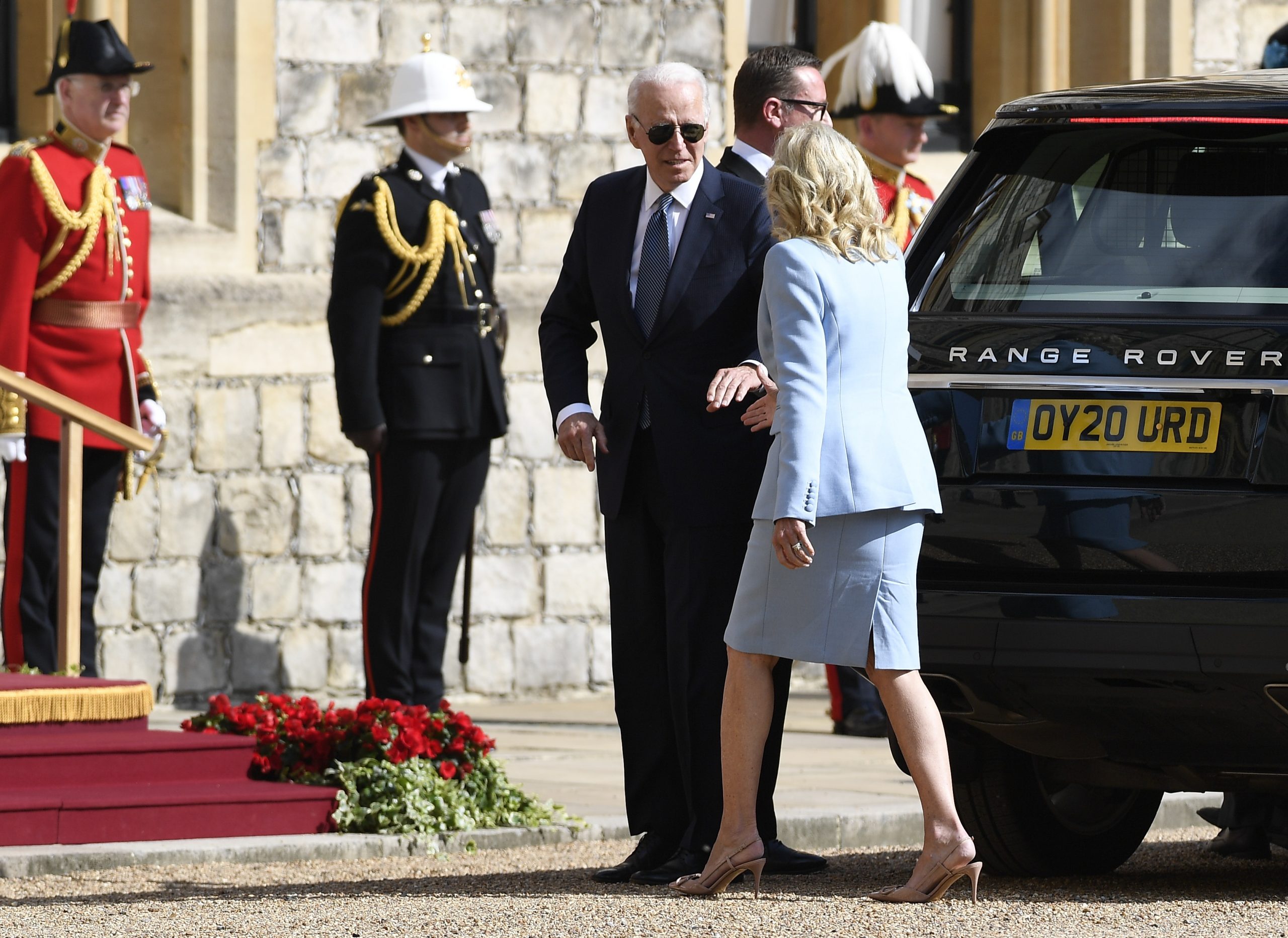 Joe Biden reaches out to hold the hand of First Lady Jill Biden