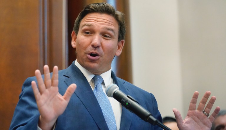 Florida Gov. Ron DeSantis gestures as he speaks, Monday, June 14, 2021, at the Shul of Bal Harbour, a Jewish community center in Surfside, Fla.