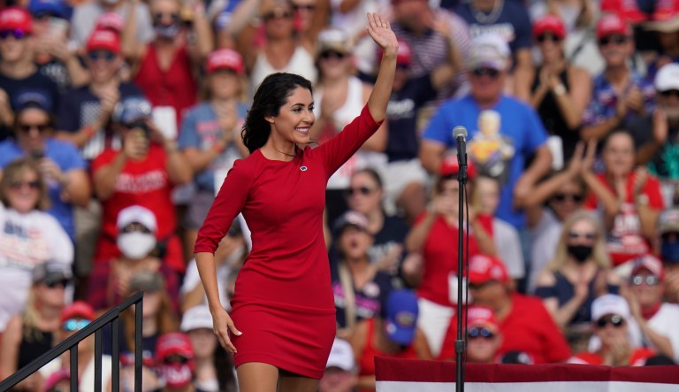 This Oct. 29, 2020, photo shows Anna Paulina Luna, a Republican candidate for House of Representatives, waving before President Donald Trump and first lady Melania Trump speak at a campaign rally in Tampa, Florida.