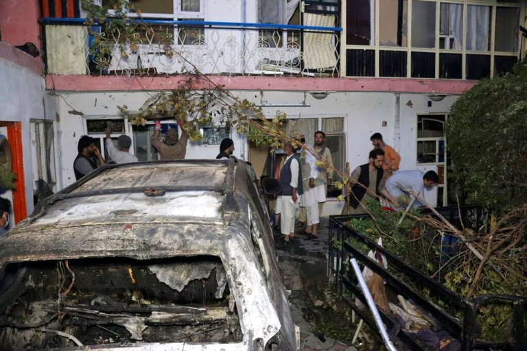 In this Sunday, Aug. 29, 2021 file photo, Afghans inspect damage of Ahmadi family house after U.S. drone strike in Kabul, Afghanistan, Sunday, Aug. 29, 2021.