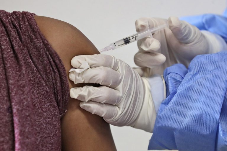 An man receives a shot of the COVID-19 vaccine during a vaccination campaign at a community health center in Tangerang on the outskirts of Jakarta, Indonesia, Thursday, Oct. 28, 2021. 