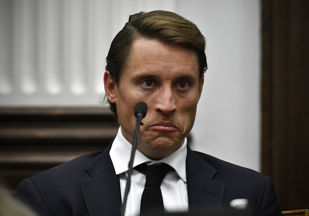  McGinniss reacts while watching video he took on Aug. 25, 2020