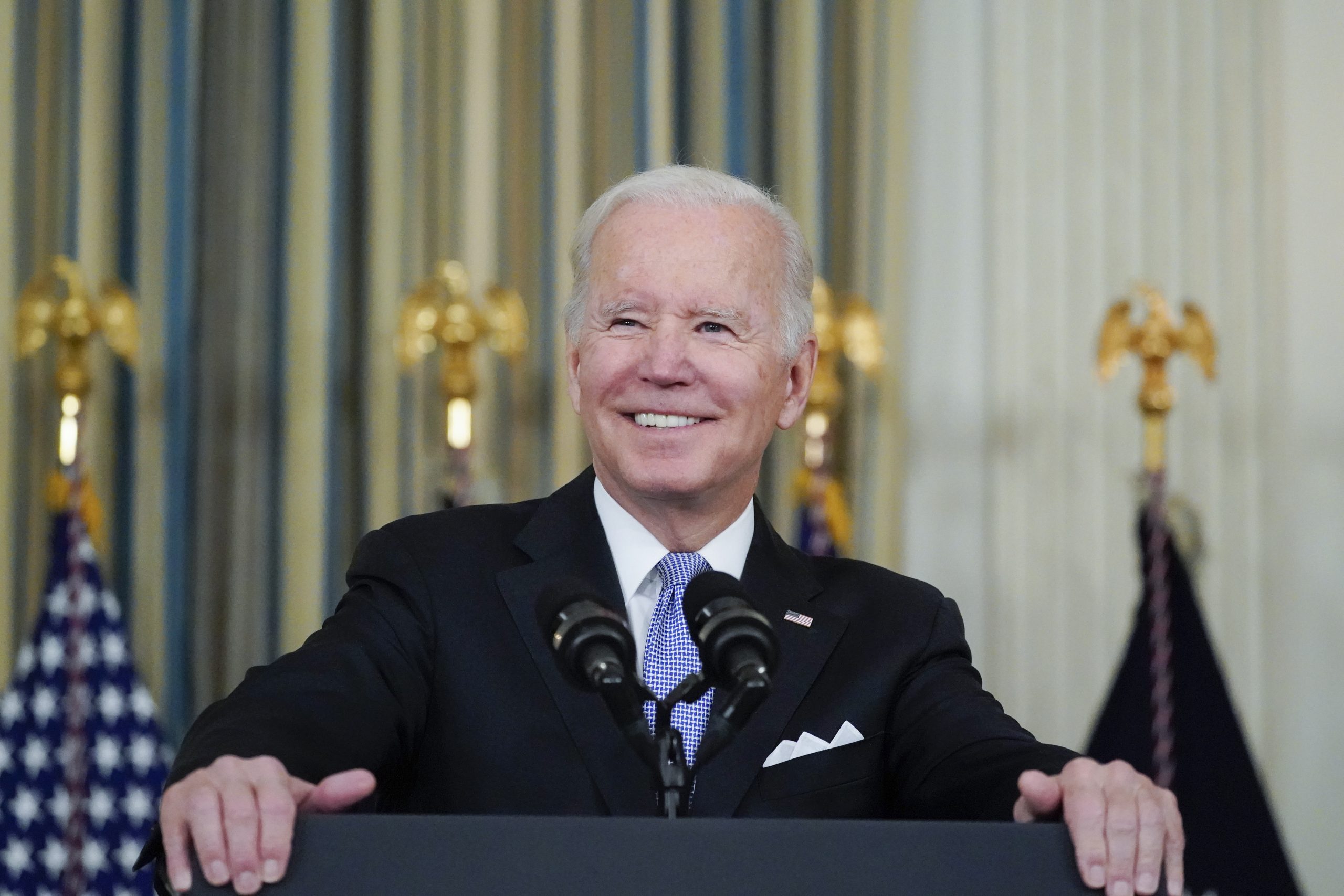 Biden digs at Trump while crowing about infrastructure and social spending bills
