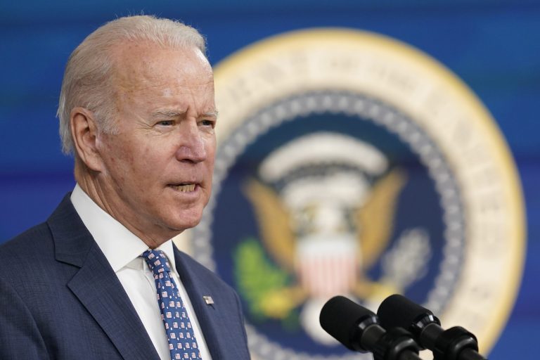 Biden vows to fight omicron surge with masks and shots, not lockdowns