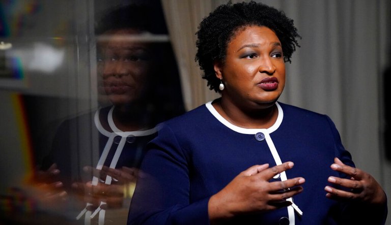 Georgia gubernatorial Democratic candidate Stacey Abrams speaks during an interview with The Associated Press on Thursday, Dec. 16, 2021, in Decatur, Ga. Abrams is calling on Congress to act on voting rights as the Democrat launches a second bid to become her state's governor. 