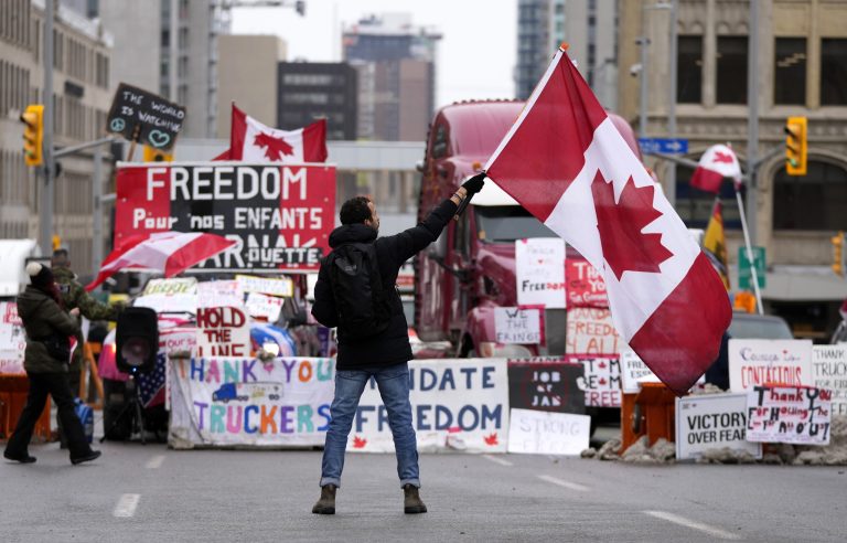 Ottawa truckers and supporters staying despite threats of arrest and bridge blockade clearing