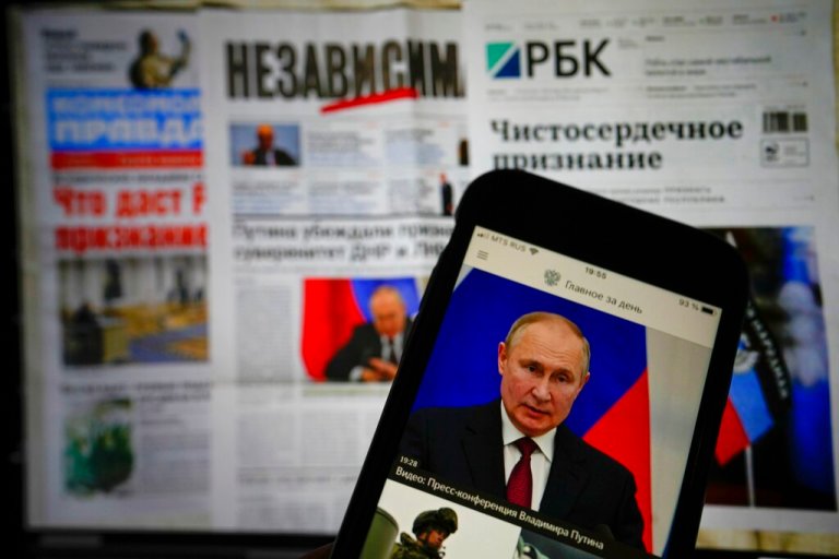 The app of the Russian government newspaper is displayed on an iPhone screen showing Russian President Vladimir Putin during his speech in the Kremlin in Moscow, Russia, Tuesday, Feb. 22, 2022.