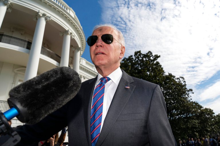 President Joe Biden speaks with reporters before boarding Marine One on the South Lawn of the White House, Wednesday, March 2, 2022, in Washington. Biden is en route to Wisconsin.