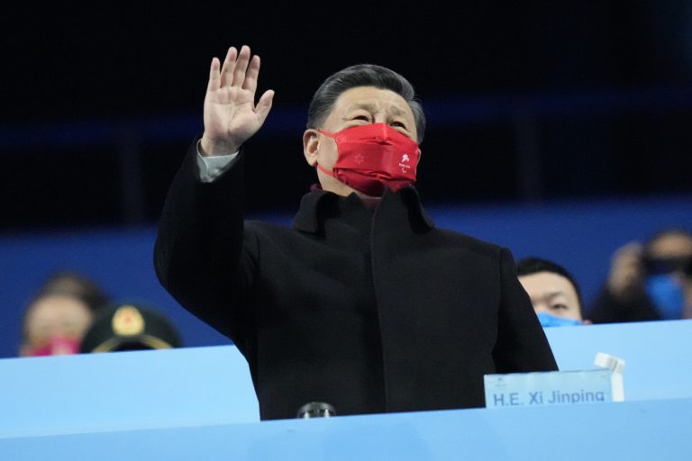 Chinese President Xi Jinping waves during the closing ceremony at the 2022 Winter Paralympics, Sunday, March 13, 2022, in Beijing.