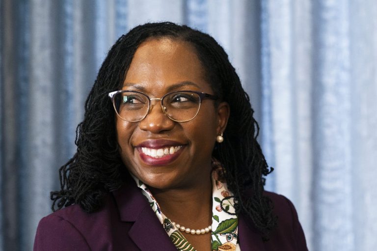 Supreme Court nominee Judge Ketanji Brown Jackson glances at members of the media during her meeting with Sen Mark Warner on Capitol Hill, Monday, April 4, 2022, in Washington. 