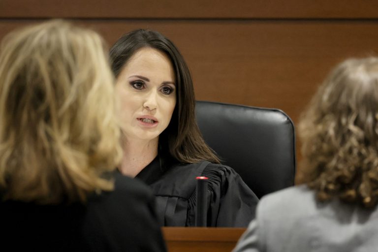 Judge Elizabeth Scherer speaks with Assistant State Attorney Carolyn McCann, left, and Assistant Public Defender Tamara Curtis during a sidebar discussion prior to jury pre-selection in the penalty phase of the trial of Marjory Stoneman Douglas High School shooter Nikolas Cruz at the Broward County Courthouse in Fort Lauderdale on Monday, April 25, 2022. Cruz previously plead guilty to all 17 counts of premeditated murder and 17 counts of attempted murder in the 2018 shootings. 