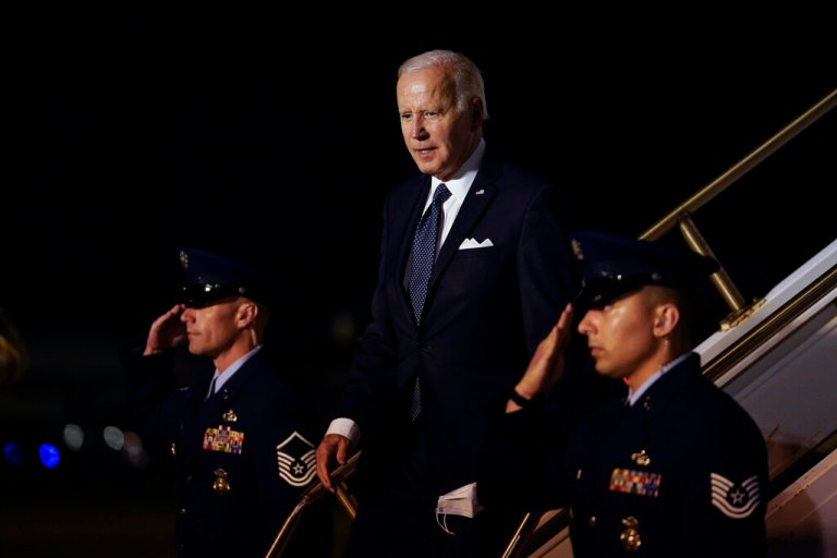 President Joe Biden walks down the steps of Air Force One at Dover Air Force Base.