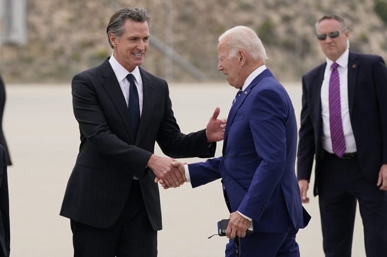 President Joe Biden (right) greets California Gov. Gavin Newsom after arriving at Los Angeles International Airport to attend the Summit of the Americas on June 8, 2022, in Los Angeles.