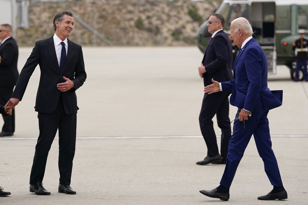 Biden and Newsom survey California storm damage