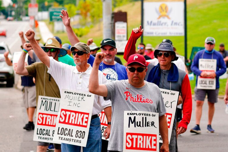 Members of Teamsters Local 830 picket outside Muller Inc. in Philadelphia, Tuesday, June 21, 2022. Union members in the beverage industry from warehouse workers to delivery drivers are striking for better working conditions and compensation. 