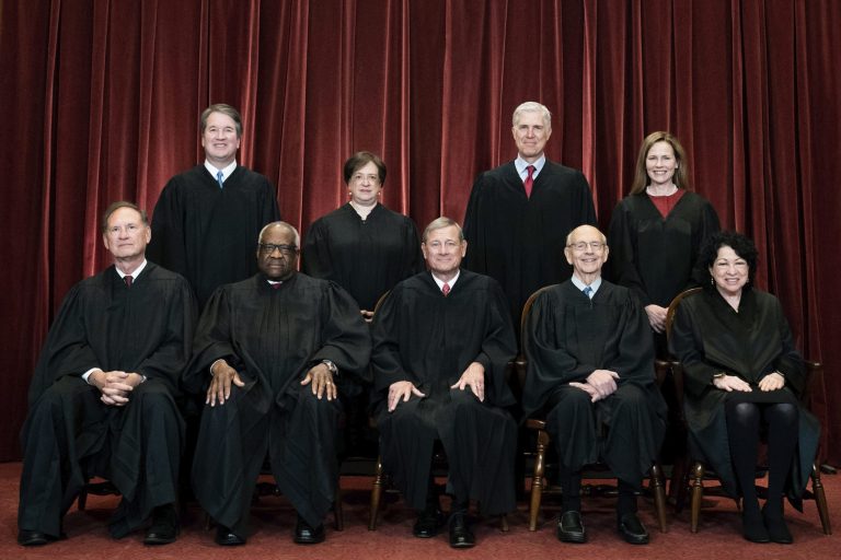 FILE - Members of the Supreme Court pose for a group photo at the Supreme Court in Washington, April 23, 2021. Kavanaugh, Alito, Thomas, Gorsuch, Coney Barrett, and Roberts are all being targeted by a liberal protest group. (Erin Schaff/The New York Times via AP, Pool)