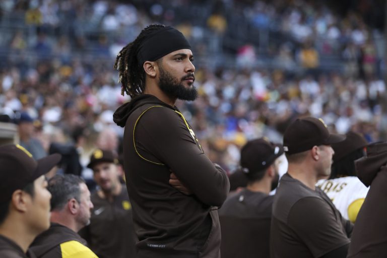San Diego Padres's Fernando Tatis Jr. watches from the dugout during the team's baseball game against the Arizona Diamondbacks, Saturday, July 16, 2022, in San Diego. 