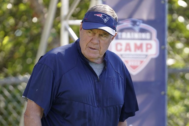 New England Patriots head coach Bill Belichick steps on the field during the NFL football team's training camp on Wednesday in Foxborough, Massachusetts.