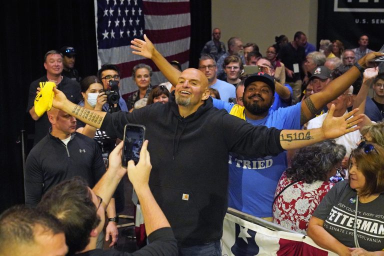 Pennsylvania Lt. Gov. John Fetterman, the state's Democratic nominee for Senate poses for a selfie with supporters after speaking at a rally in Erie, Pennsylvania, on Friday.