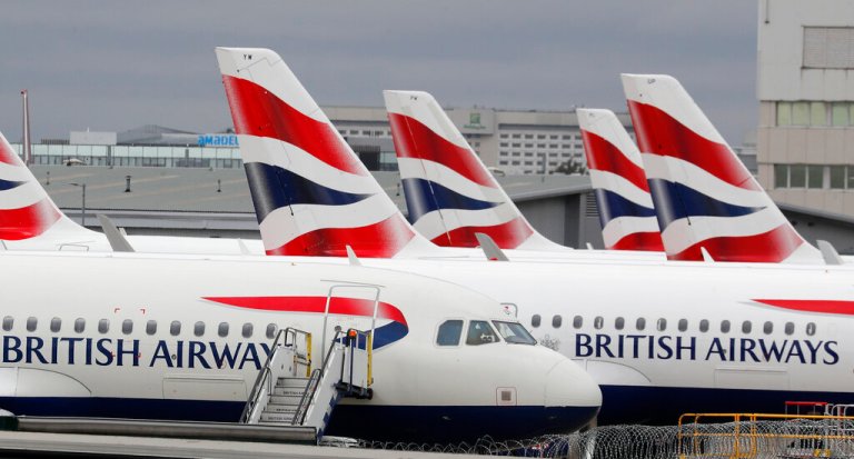 British Airways planes parked at Heathrow Airport's Terminal 5 in London, Wednesday, March 18, 2020. 