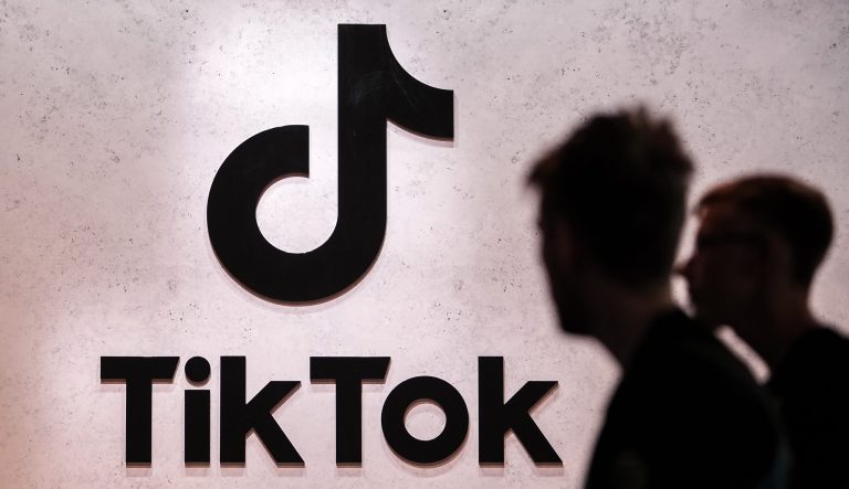 Visitors pass the TikTok exhibition stands at the Gamescom computer gaming fair in Cologne, Germany, on Aug. 25, 2022.
