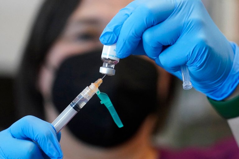 A registered nurse prepares a dose of a monkeypox vaccine at the Salt Lake County Health Department in Salt Lake City on July 28, 2022. 