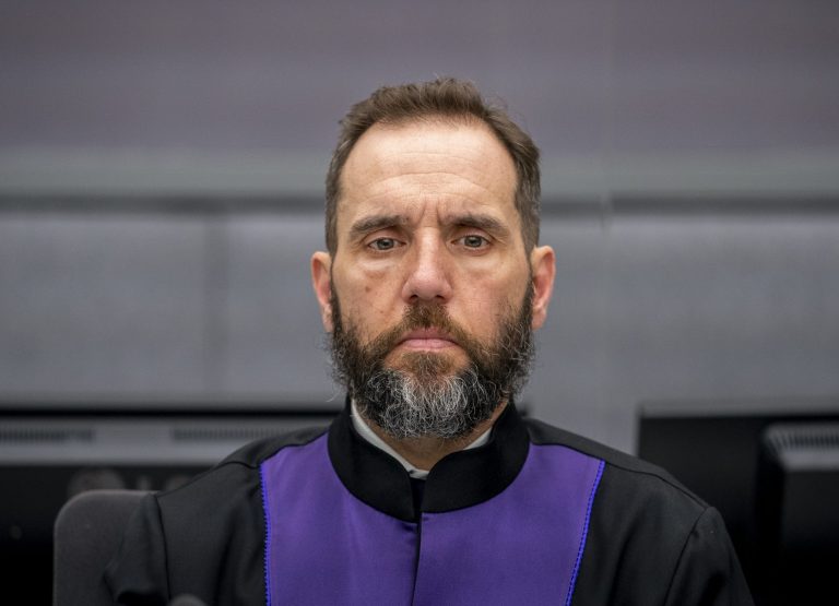 Prosecutor Jack Smith listens as Hashim Thaci, not pictured, makes his first courtroom appearance before a judge at the Kosovo Specialist Chambers court in The Hague, Netherlands, Nov. 9, 2020. 