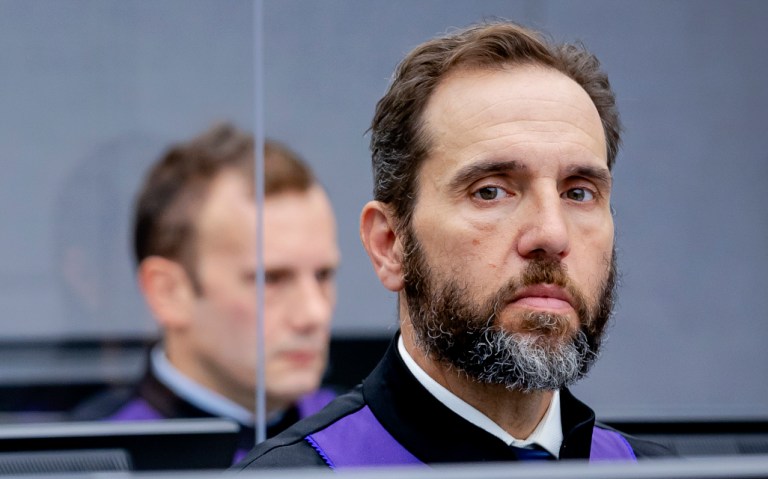 Prosecutor Jack Smith waits for the start of the trial against Salih Mustafa at the Kosovo Specialist Chambers court in The Hague, Netherlands, on Sept. 15, 2021.