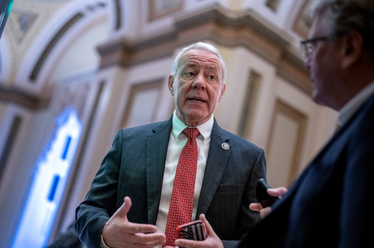 Rep. Ken Buck, R-Colo., a member of the conservative House Freedom Caucus, stops for a reporter as he heads to the chamber for votes, at the Capitol in Washington, Friday, Dec. 2, 2022. (AP Photo/J. Scott Applewhite)