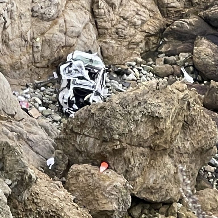 This image from a video provided by San Mateo County Sheriff's Office shows a Tesla vehicle that plunged off a Northern California cliff along the Pacific Coast Highway, Monday, Jan. 2, 2023, near an area known as 