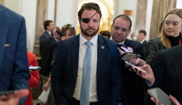Rep. Dan Crenshaw, R-Texas, talks to reporters as he walks out of the House chamber as voting continued for a second day to elect a speaker and convene the 118th Congress in Washington, Wednesday, Jan. 4, 2023.
